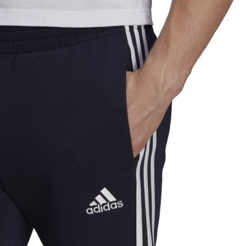 Spodnie adidas Essentials Tapered Cuff 3 Stripes M GK8977 Spodnie adidas Essentials Tapered Cuff 3 Stripes M GK8977