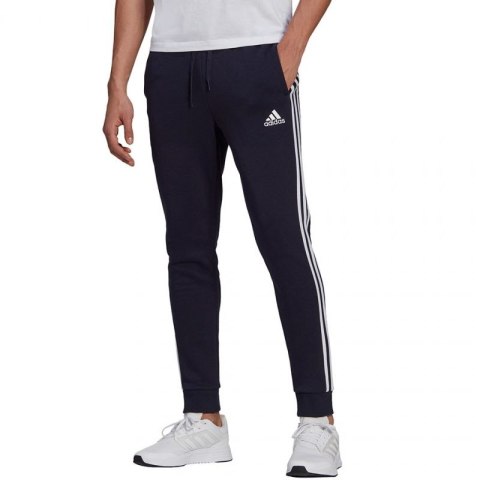 Spodnie adidas Essentials Fleece Tapered Cuff 3-Band M GK8823 Spodnie adidas Essentials Fleece Tapered Cuff 3-Band M GK8823