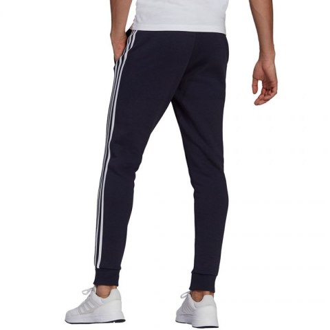 Spodnie adidas Essentials Fleece Tapered Cuff 3-Band M GK8823 Spodnie adidas Essentials Fleece Tapered Cuff 3-Band M GK8823